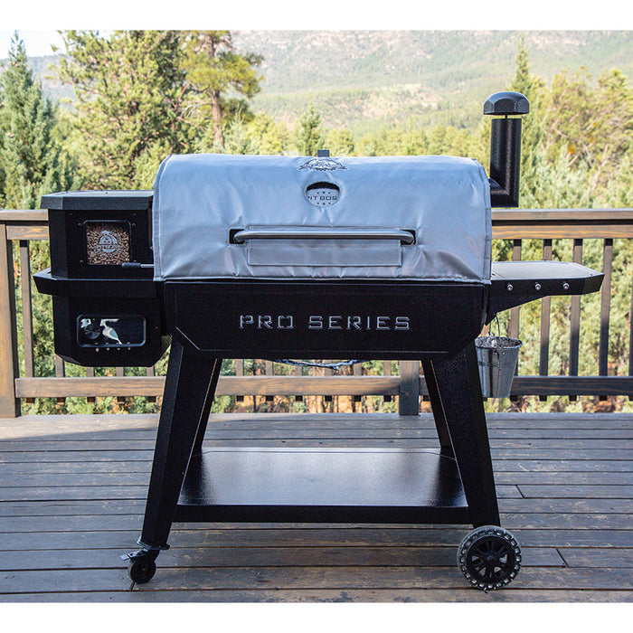 silvery grey grill insulated blanket on smoker in woody deck