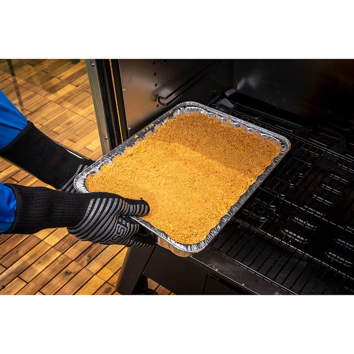 Large all-purpose foil pan from Pit Boss Grills being used in an outdoor grill.