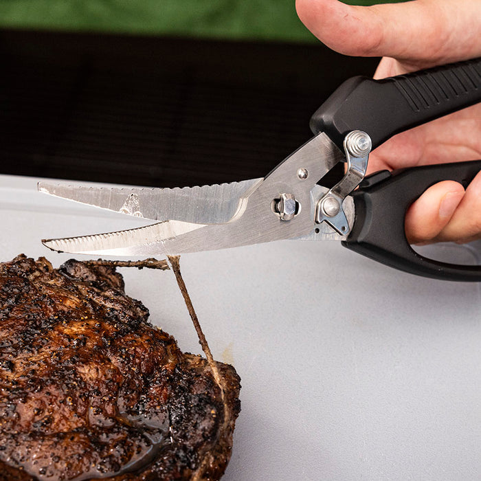 Pit Boss BBQ Shears cutting twine off of smoked prime rib