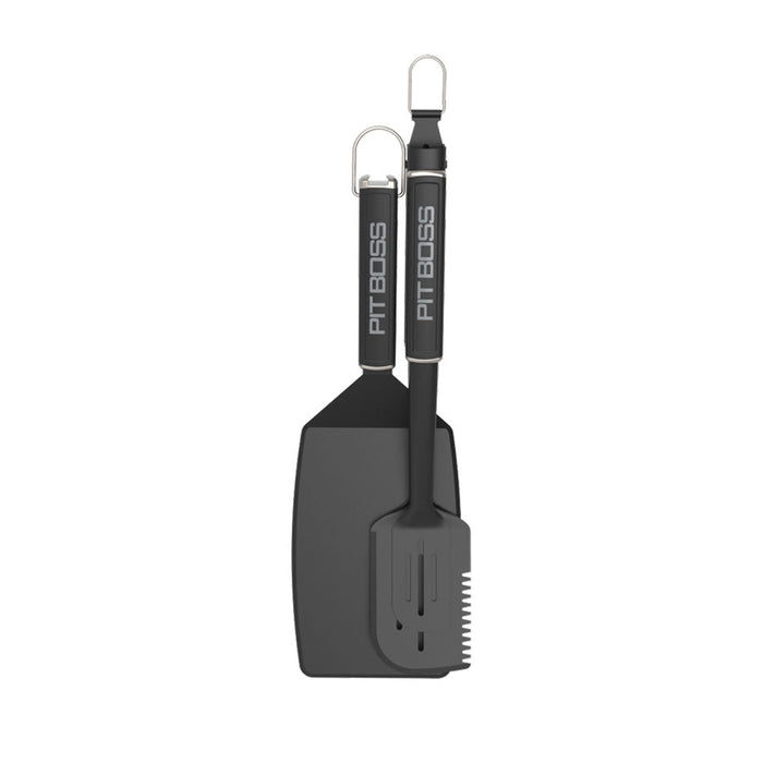 Big Head Spatula and All-in-One Tool. Black grilling tools with silver accents. Pit Boss name on both handles.