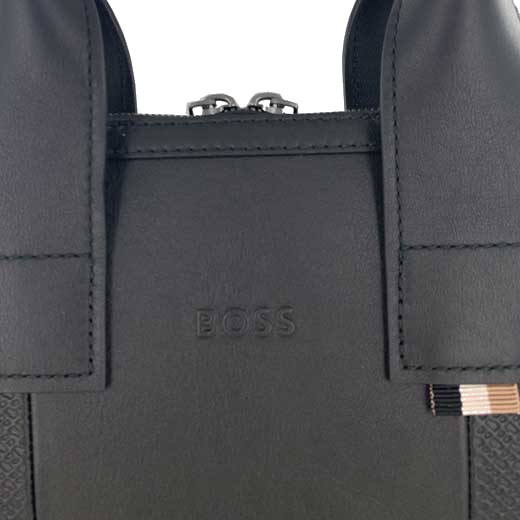 The Hugo Boss brand name has been embossed into the leather of this bag.