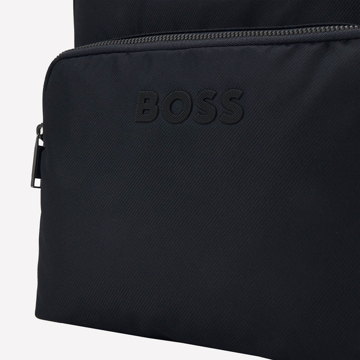 This Navy BOSS Catch 3.0 backpack comes with the logo attached to the front of the zipped pocket.