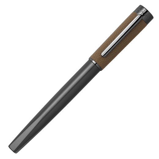 This Corium Chrome Fountain Pen Camel by Hugo Boss is made with gunmetal brass and has the brand name engraved along the top of the cap.