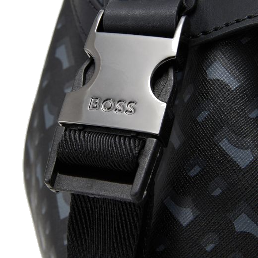 This Icon Monogram Print Faux Leather Backpack by BOSS has a buckle closure on the straps that has the BOSS brand name engraved.