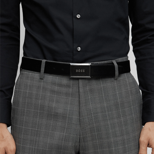 This Interchangeable Plaque & Pin Buckle Reversible Belt Black by BOSS has a plaque buckle with the BOSS brand name engraved and also a pin buckle with the branding on the keeper.