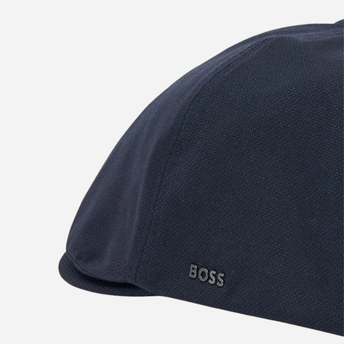 The BOSS logo on the BOSS Navy Blue Trystan Techwool Flat Cap.
