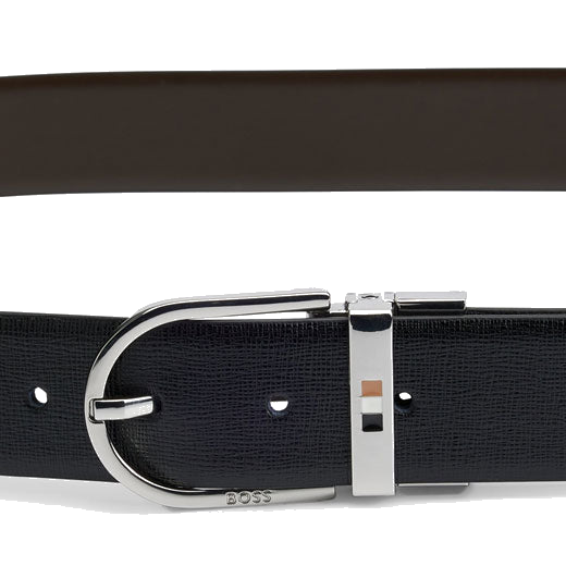 This BOSS Otif Reversible Italian Leather Belt with Signature Stripe Inlay has small engraving with the brand name on the pin buckle.