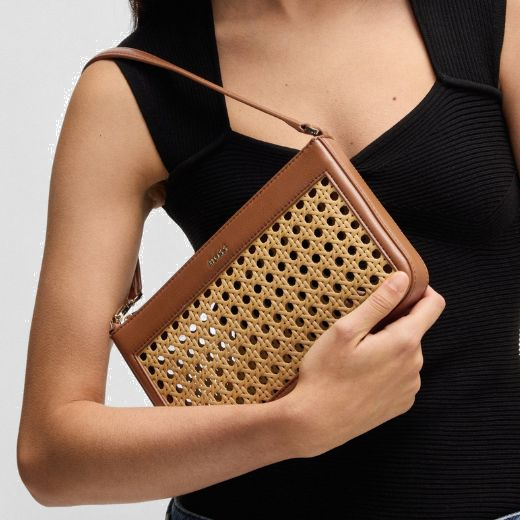 This Sandy Brown Faux Leather Woven Shoulder Bag has the brand name in polished gold lettering on the front faux leather panel.