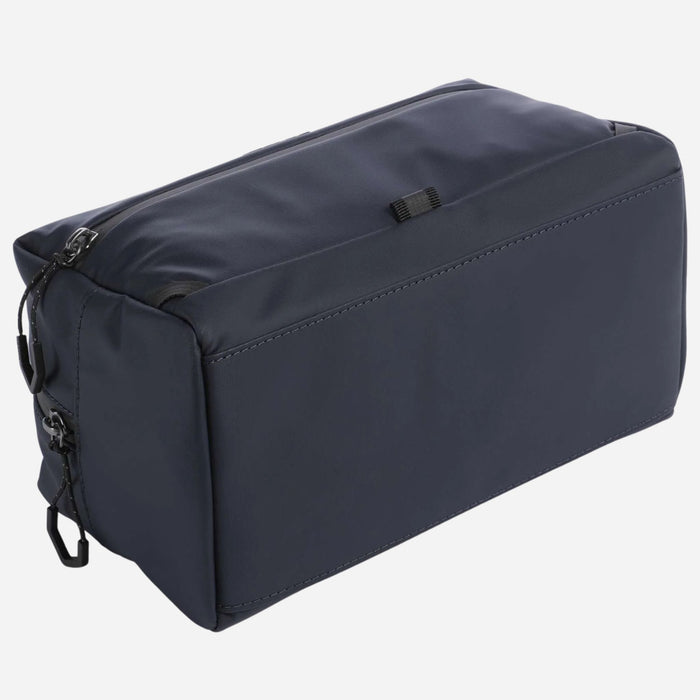The base of the BOSS Stenson Navy Blue Wash Bag with Raised Black Logo.