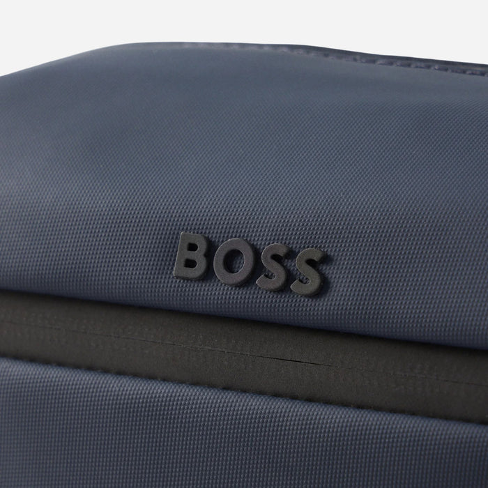 Close up of the logo on the BOSS Stenson Navy Blue Wash Bag with Raised Black Logo.
