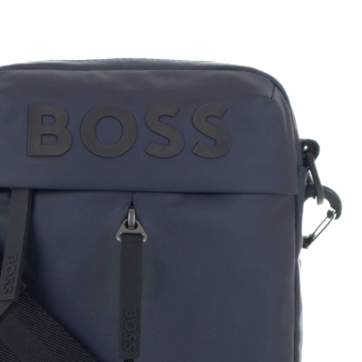 This Stormy Dark Blue Shoulder Bag by BOSS has two front zip pockets, one going across and one going vertically.