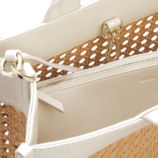 This White Faux Leather Woven Tote Bag With Zip Pouch by BOSS has polished gold hardware with the matching lettering on the front that has the BOSS brand name.