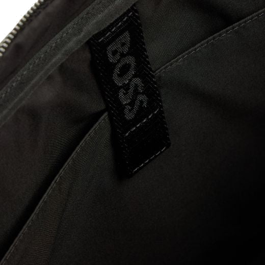 The Zair Monogram Faux Leather Document Case by BOSS comes with a padded laptop compartment inside with extra slip pockets.