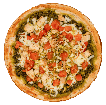 Pesto chicken cauliflower pizza topped with fresh basil