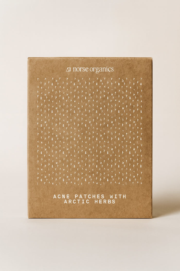 Norse Organics Acne Patches with Arctic Herbs in a kraft box printed with white Norse runes