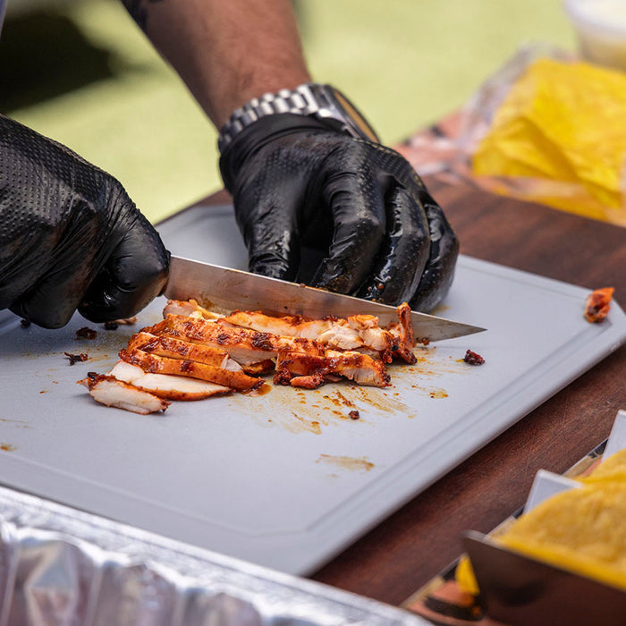 Pit Boss Food Prep kit knife and cutting board cutting chicken for grilled tacos