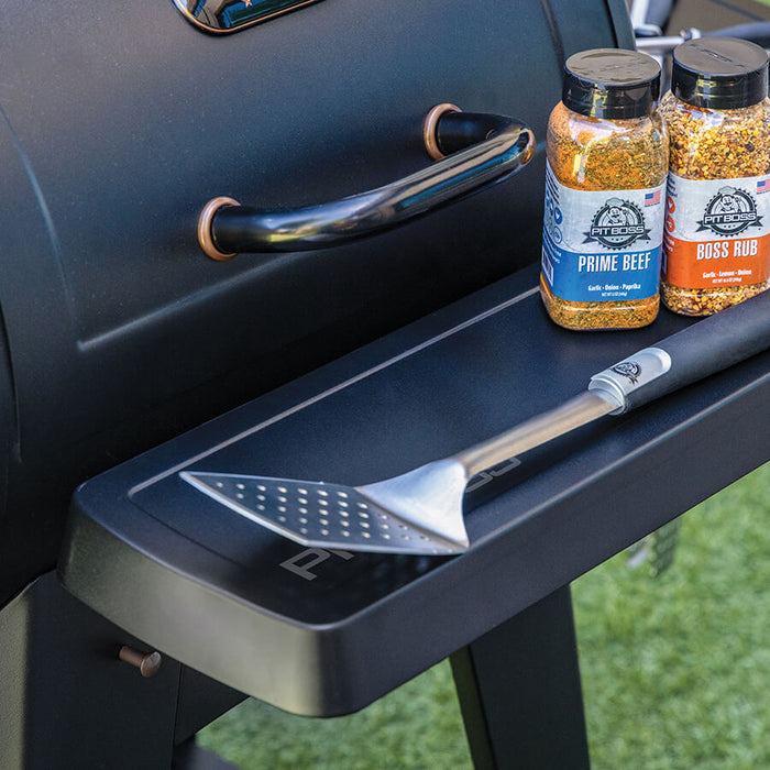 Pit Boss Grills Front Shelf - 500 Series Onyx/FB2, black grill accessory with seasoning jars and spatula.