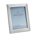 This Bernadotte Medium Picture Frame 5x7" by Georg Jensen looks great in any room and shows off a photo whilst adding a modern and classic feel.