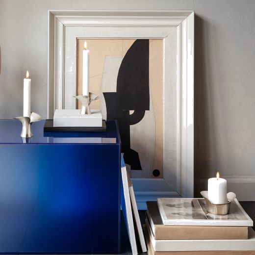 This Bloom Pillar Stainless Steel Candle Holder by Georg Jensen looks great placed in any room of the home.