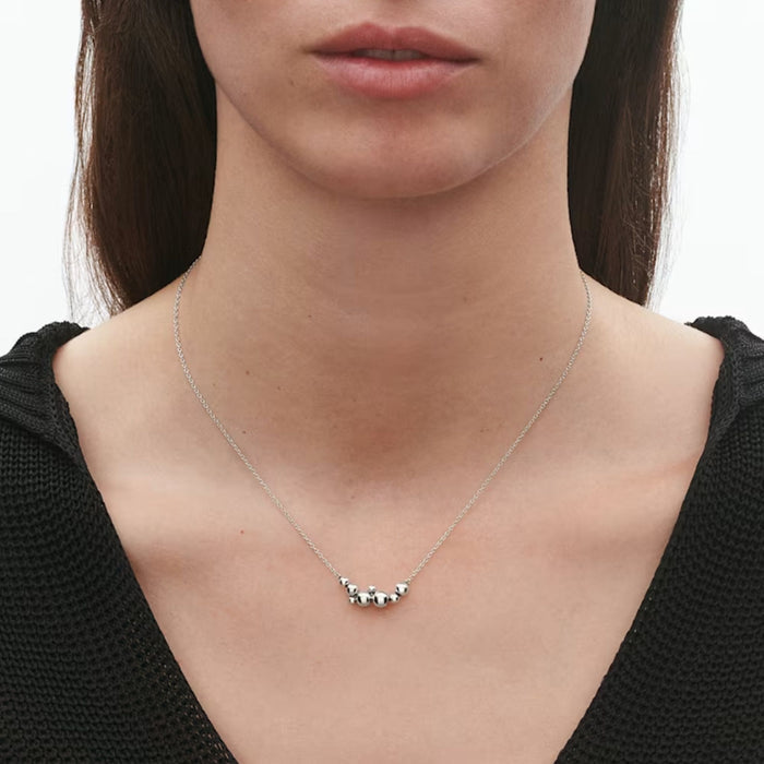 Model Shot of Moonlight Grapes Oxidised Sterling Silver Pendant from Georg Jensen.