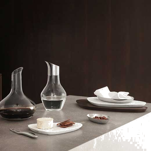 This Georg Jensen Sky Glass Water Pitcher has been crafted out of glass and stainless steel.