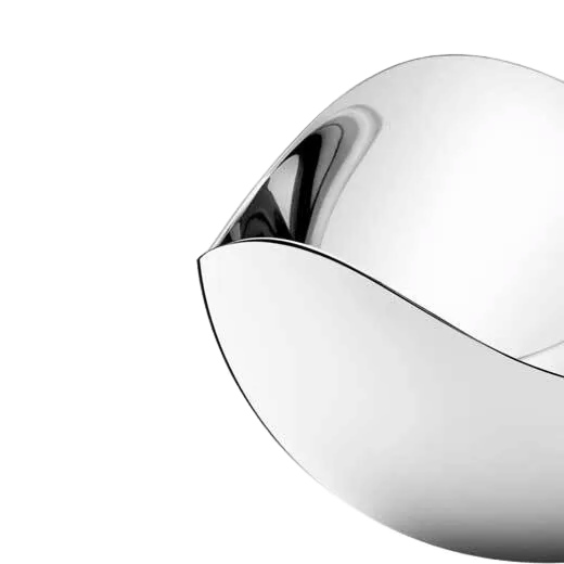 This Georg Jensen Stainless Steel Bloom Salt Cellar features a matching spoon.