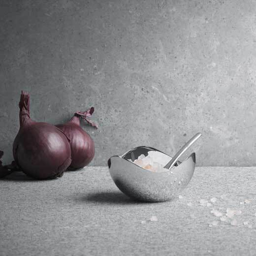 This Georg Jensen Stainless Steel Bloom Salt Cellar with Spoon is suitable for food.