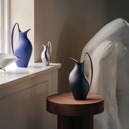 This Georg Jensen Stainless Steel HK 0.2L Petite Pitcher is made out of mirrored stainless steel with a glossy finish.