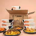 High protein meal plan box packed with macro-rich chicken, beef, and vegetable entrees