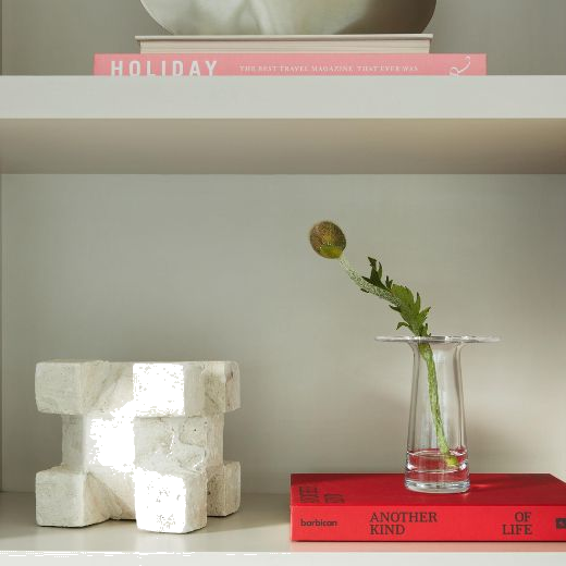 This LSA Victoria Clear Glass Vase 15 cm can be placed on a shelf to display a single flower or a small bunch.