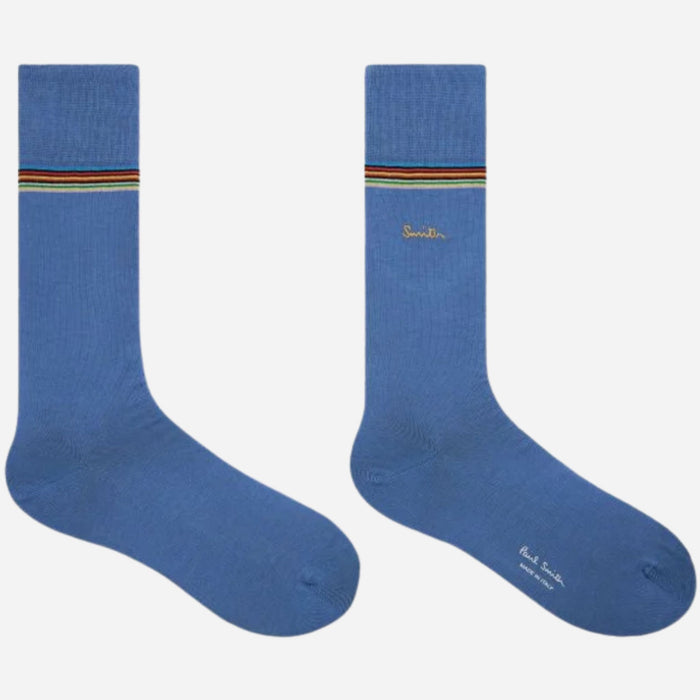 The inside and outside view of the light blue pair from the The dark blue pair from the Paul Smith 3-Pack Signature Stripe Mid-Calf Socks with Gold Logo.