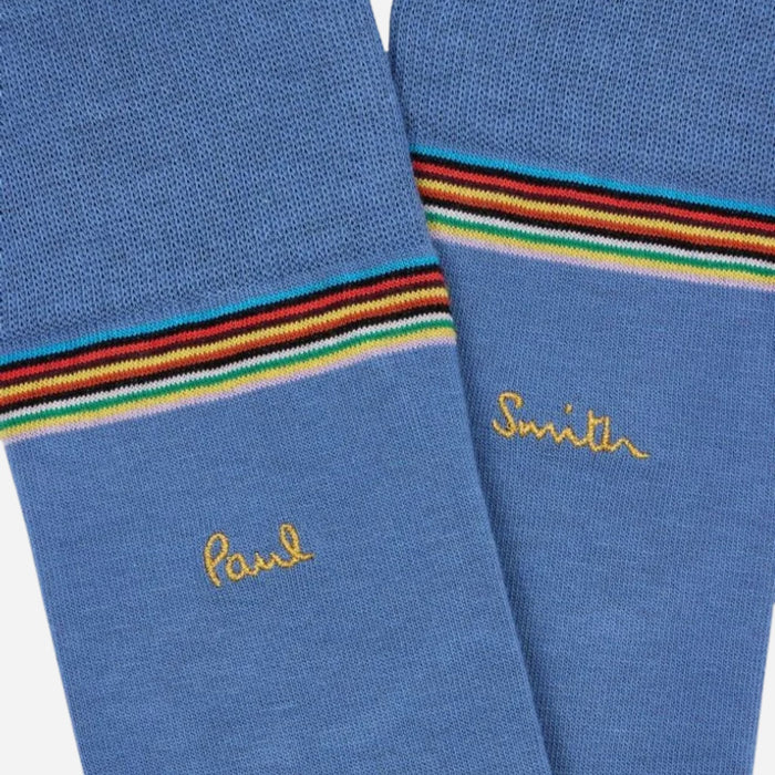 Close up of the light blue pair from the Paul Smith 3-Pack Signature Stripe Mid-Calf Socks with Gold Logo.