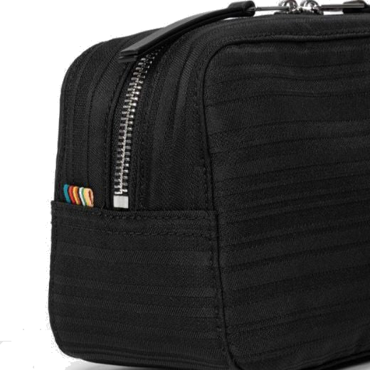 This Black Shadow Stripe Wash Bag by Paul Smith has polished silver hardware and black zip pulls.