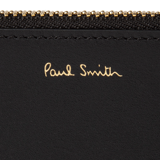 This Black 'Signature Stripe' Leather 4CC Zip Pouch by Paul Smith has the brand name in gold foil embossing on the front.