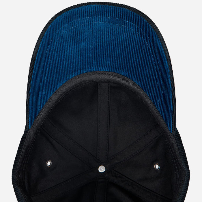 Underneath the peak of the Paul Smith Black Corduroy Cap with Signature Stripe Adjustable Strap.
