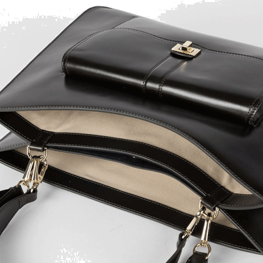 This Brown Double Leather 'Signature Stripe' Bag by Paul Smith has a sand coloured lining.