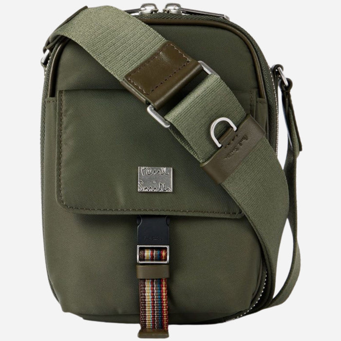 The cross body strap on the Paul Smith Green Recycled Nylon Small Flight Bag with Signature Stripe Trims.