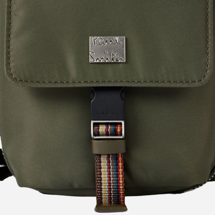 The Paul Smith logo on the front of the Paul Smith Green Recycled Nylon Small Flight Bag with Signature Stripe Trims.
