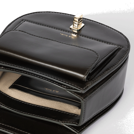 This Leather Tear Drop Cross Body Bag by Paul Smith has 2 interior card slots.