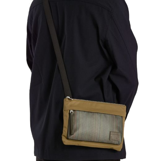 This Men's 'Signature Stripe' Khaki Cross Body Bag is great for casual days out and has a zip into the main compartment with a chunky crossbody strap and silver hardware.