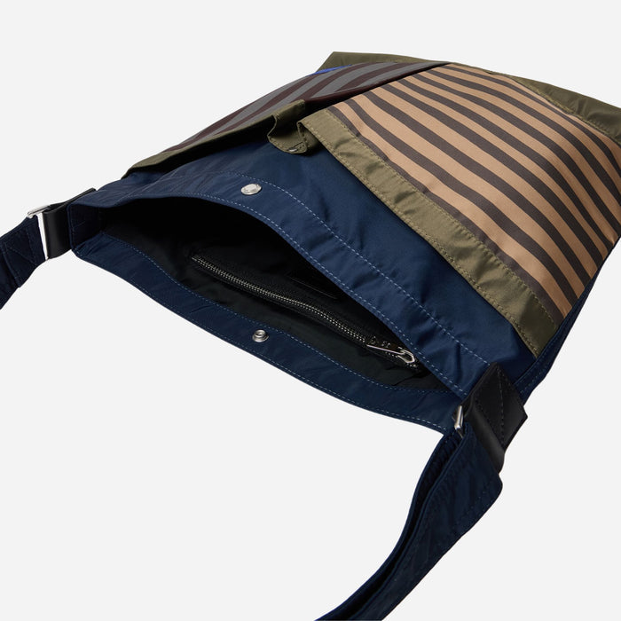 Inside the Paul Smith Multistripe Recycled Nylon Adjustable Tote Bag with Signature Logo Patch.
