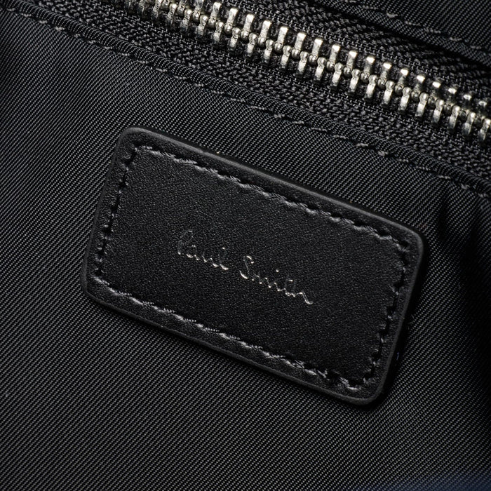 The Paul Smith signature embossed in silver foil inside the Paul Smith Multistripe Recycled Nylon Adjustable Tote Bag with Signature Logo Patch.