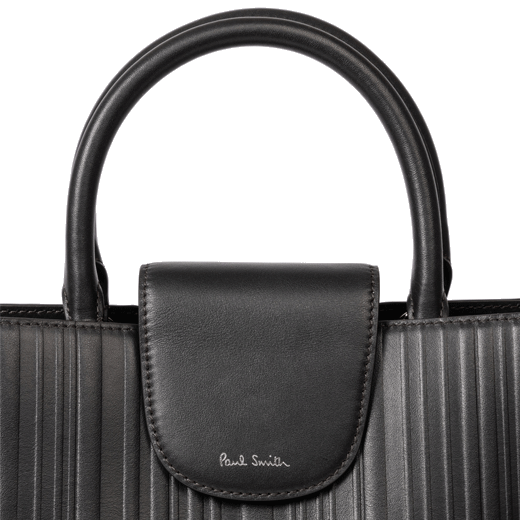 This Paul Smith Shadow Stripe Brown Leather Bucket Bag has two grab handles and a shoulder strap.
