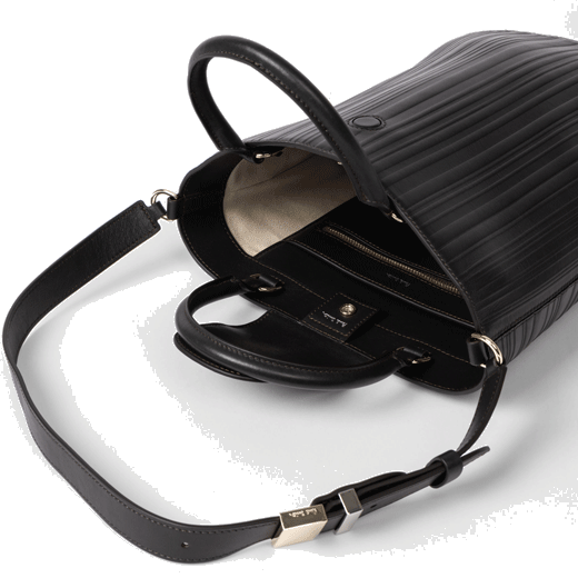 This Shadow Stripe Brown Leather Bucket Bag by Paul Smith has a magnetic dot flap closure and an open top.