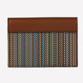 This Paul Smith card holder features a smooth leather and multi colour canvas design.