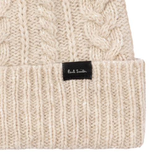 This Women's Beige Wool Cable Knit Pom-Pom Beanie Hat by Paul Smith has a turn-up edge with a ribbed knit look and the Paul Smith label in contrasting black.