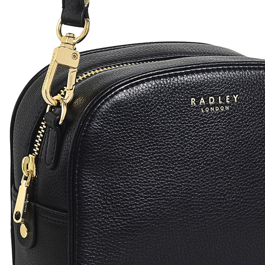 Radley's Arden Crescent Black Cross Body Bag has the brand name on the front in gold foil embossing.