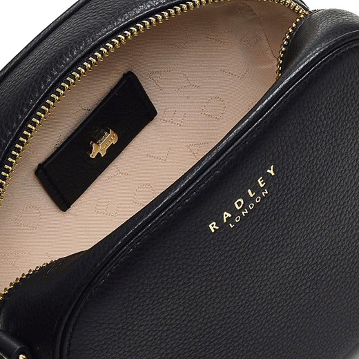 This Arden Crescent Black Cross Body Bag by Radley has jacquard lining with the Radley brand name and the Scottie Dog leather patch stitched into it.