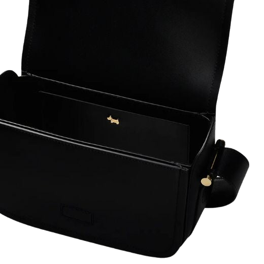The interior of the Bathurst Mews Black Medium Flapover Cross Body Bag is lined with bonded faux suede.
