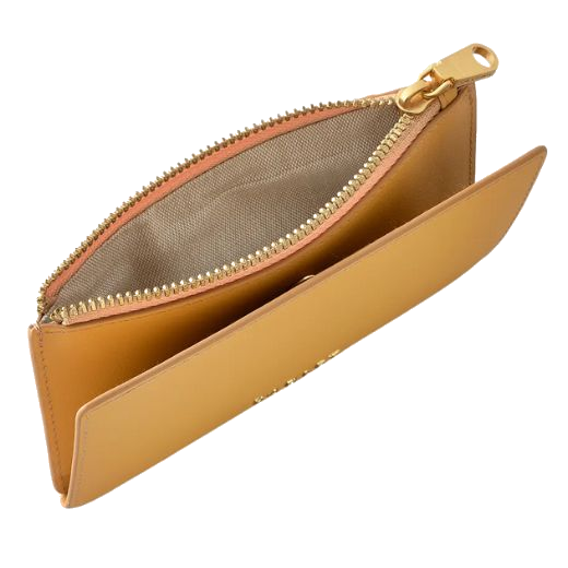 The Radley brand name is found on the front of the Coin Street Pecan Medium Ziptop Purse in gold metal letters.